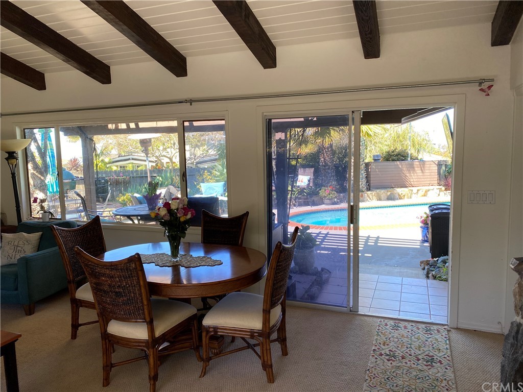 30772 Marilyn Drive Laguna Beach, CA 92651 - Photo 22 of 26 a view of a dining room with furniture wooden floor and chandelier