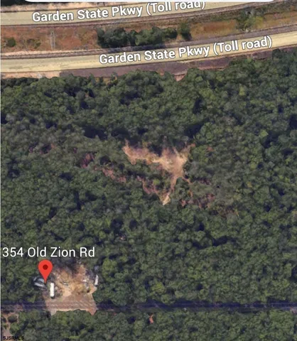 a view of a field with trees