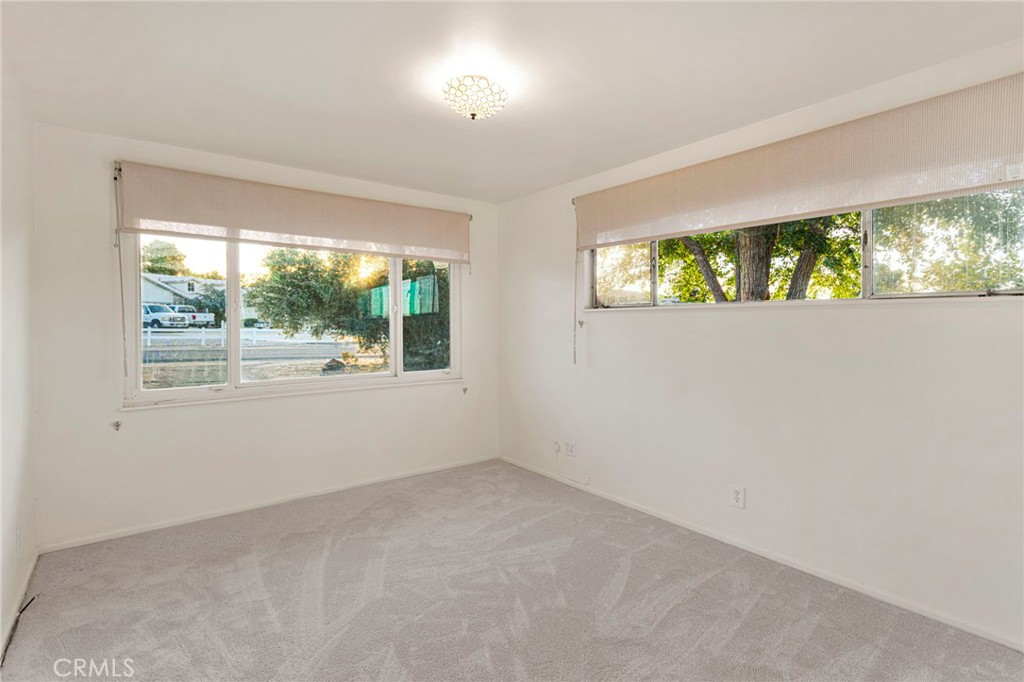 15177 Mendota Road North Apple Valley, CA 92307 - Photo 20 of 50 a view of an empty room with a window