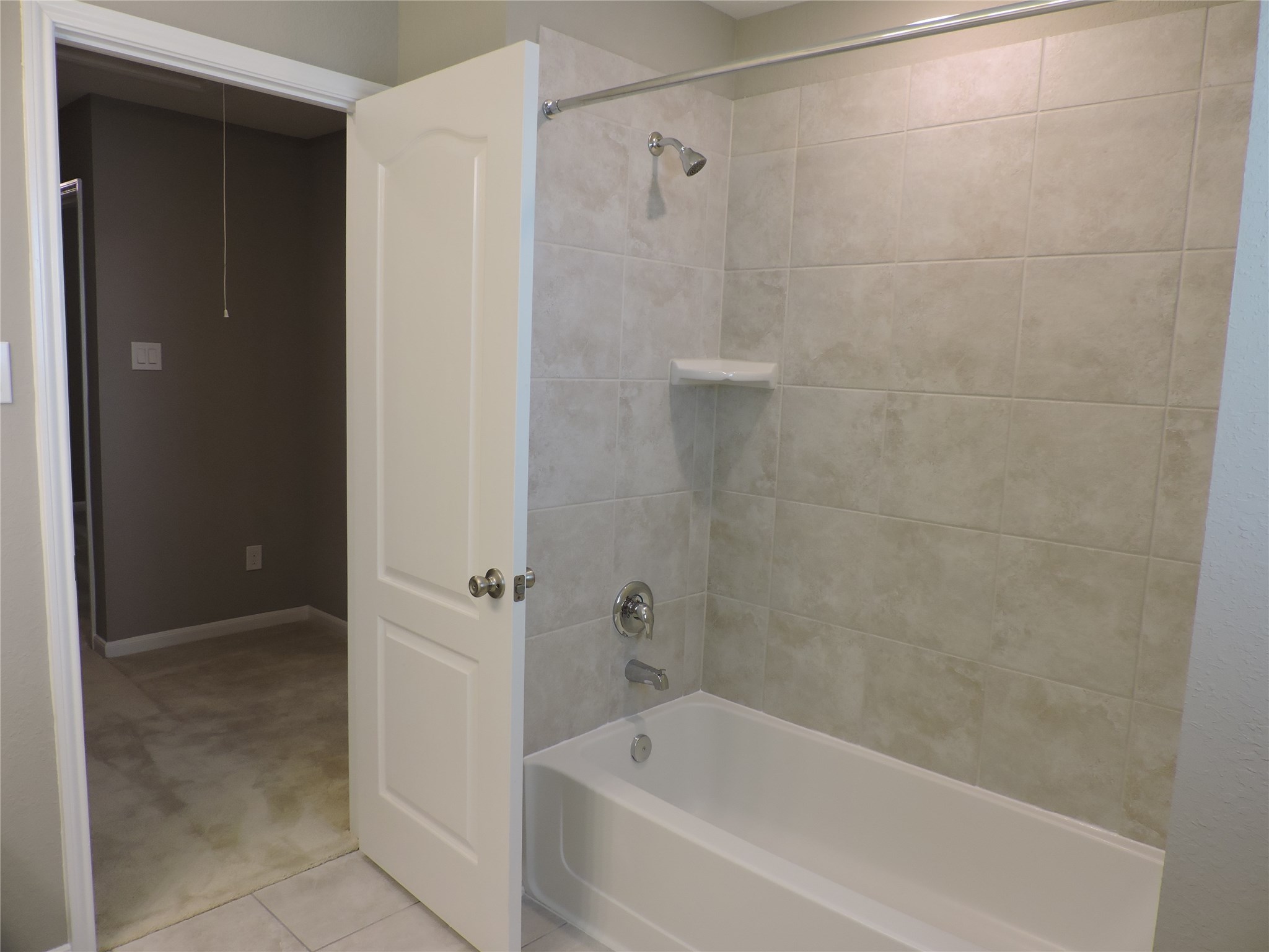 1102 Upton Court Conroe, TX 77304 - Photo 23 of 30 a bathroom with a bathtub