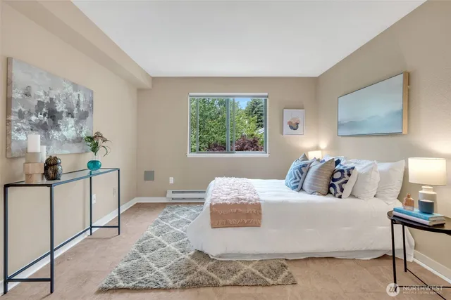 a bedroom with a bed and a couch