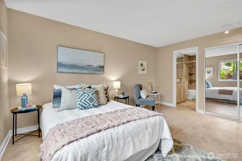 a living room with furniture and a dining table