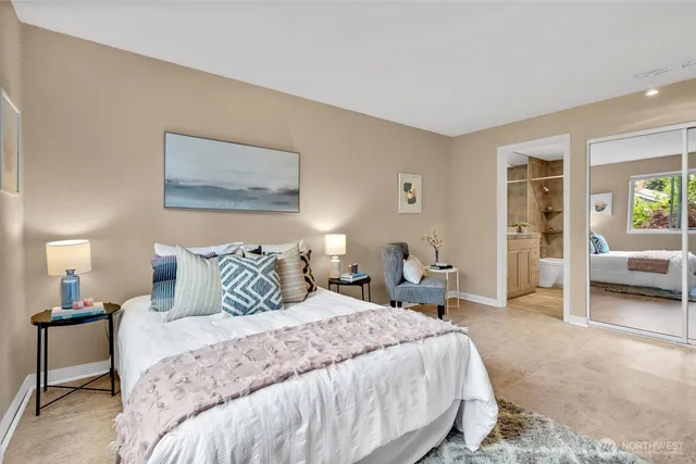 a living room with furniture and a dining table
