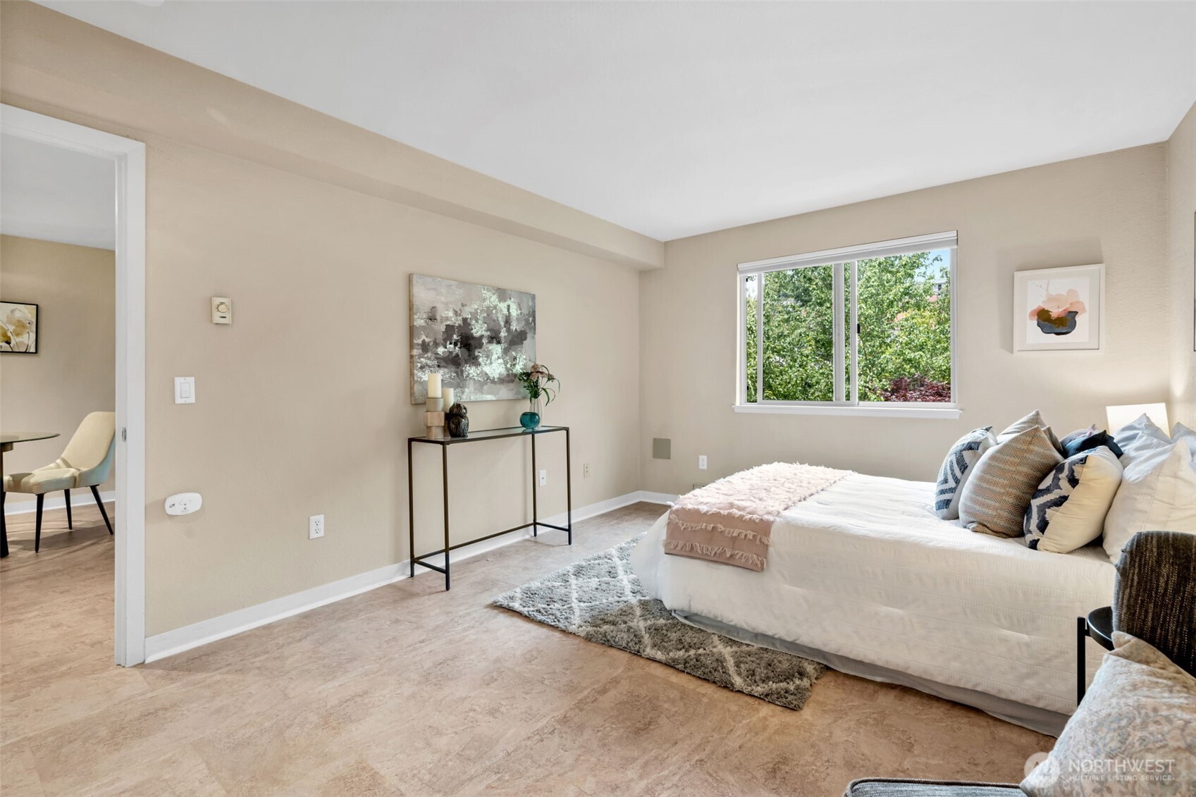275 West Roy Street, Unit 319 Seattle, WA 98119 - Photo 15 of 30 a bedroom with a bed and a painting on the wall