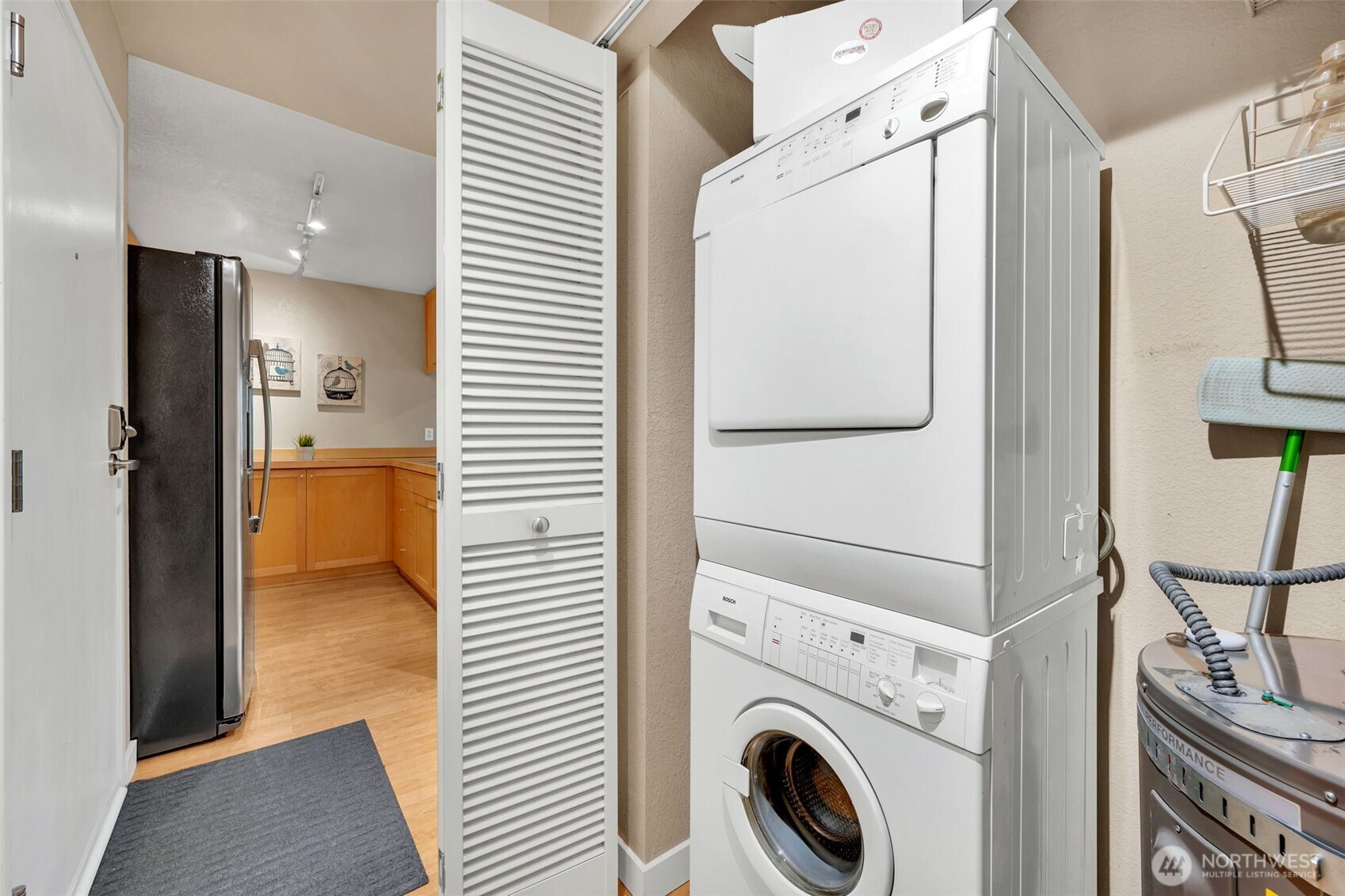 275 West Roy Street, Unit 319 Seattle, WA 98119 - Photo 19 of 30 a view of hallway with washer and dryer
