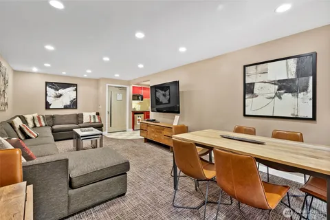 a view of a patio with a table and chairs under an umbrella
