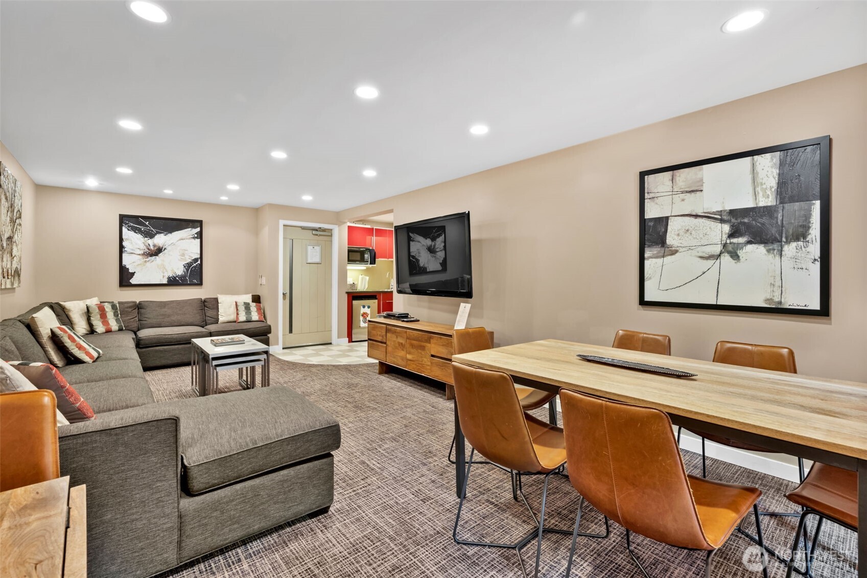 275 West Roy Street, Unit 319 Seattle, WA 98119 - Photo 24 of 30 a living room with furniture and a flat screen tv