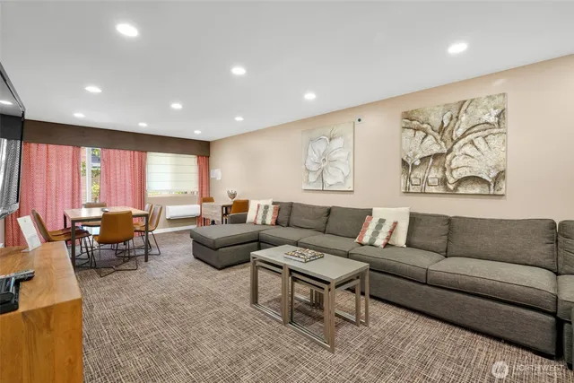 a front view of a building with outdoor seating