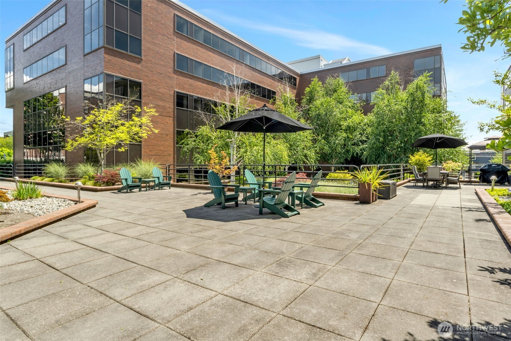 275 West Roy Street, Unit 319 Seattle, WA 98119 - Photo 27 of 30 a view of a building with sitting area and garden