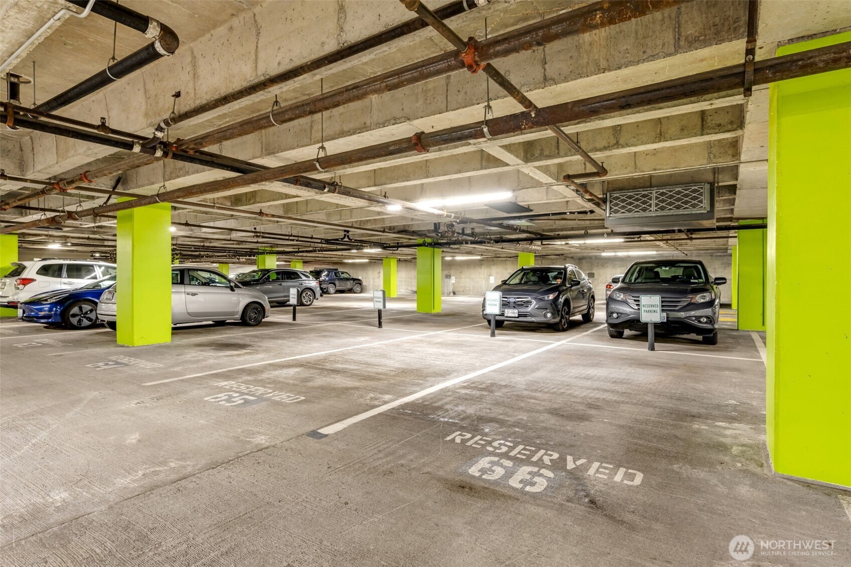 275 West Roy Street, Unit 319 Seattle, WA 98119 - Photo 30 of 30 a view of parking garage with cars