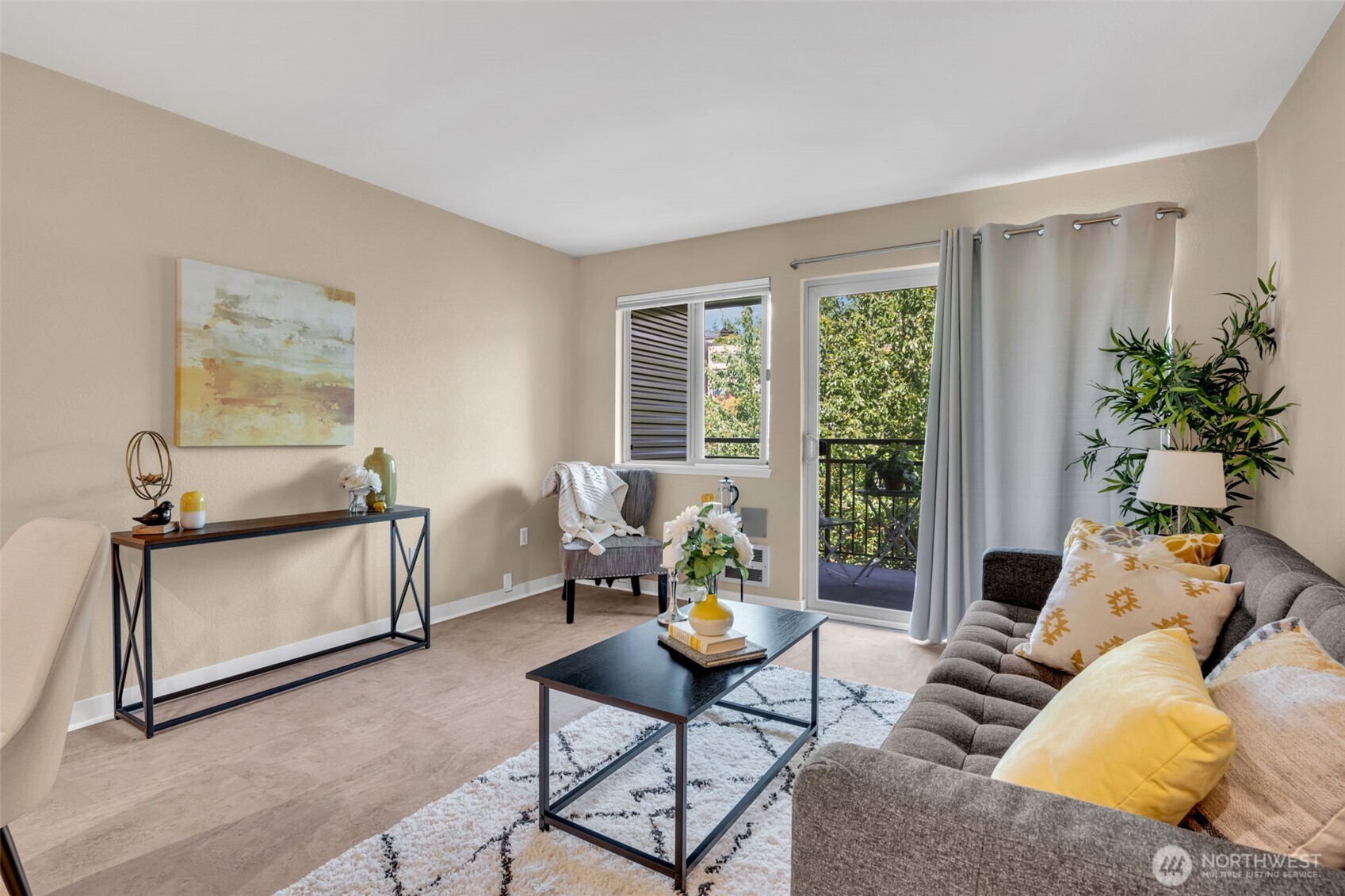 275 West Roy Street, Unit 319 Seattle, WA 98119 - Photo 7 of 30 a living room with furniture and a window