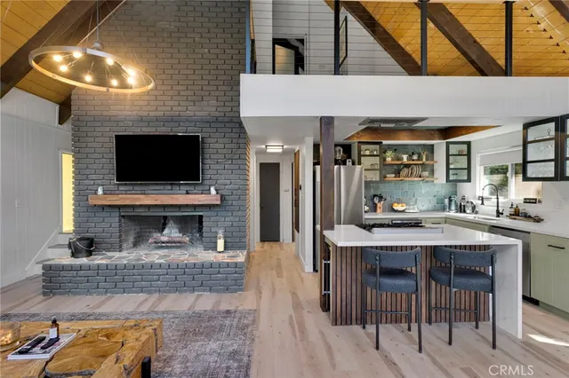 a kitchen that has a cabinets a sink and a stove