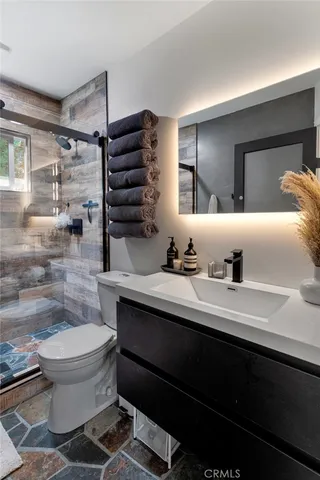 a bedroom with furniture and natural light