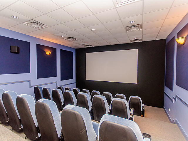 1111 West 15th Street, Unit 123 Chicago, IL 60608 - Photo 19 of 24 a projector room with furniture