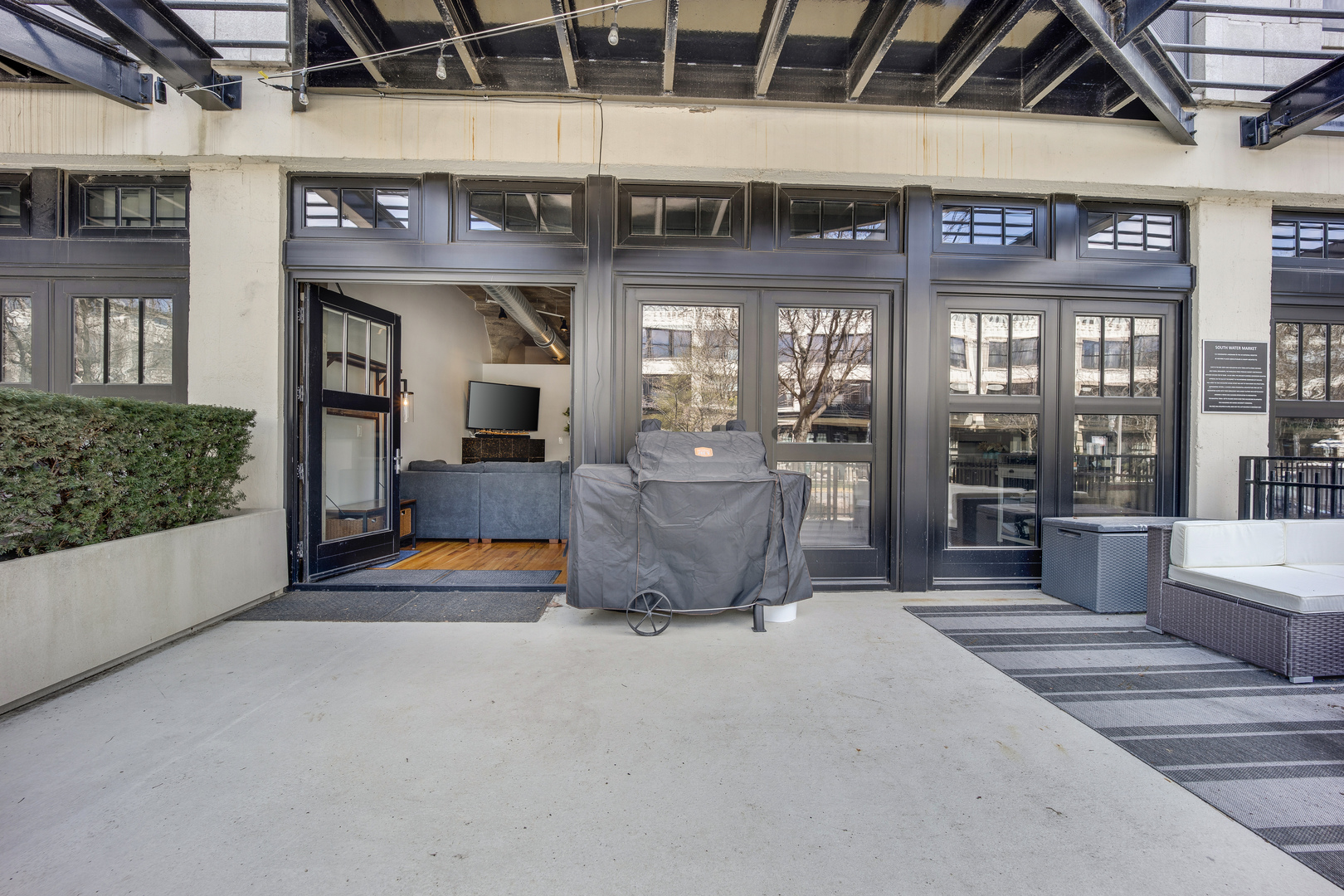 1111 West 15th Street, Unit 123 Chicago, IL 60608 - Photo 2 of 24 a view of a building with seating area
