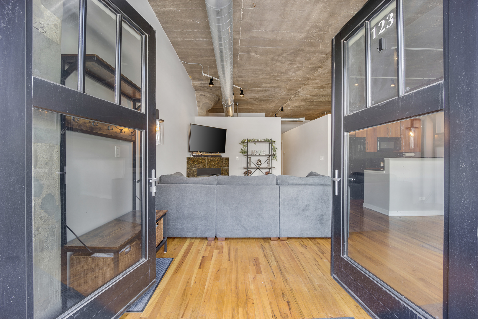 1111 West 15th Street, Unit 123 Chicago, IL 60608 - Photo 3 of 24 a view of balcony and kitchen