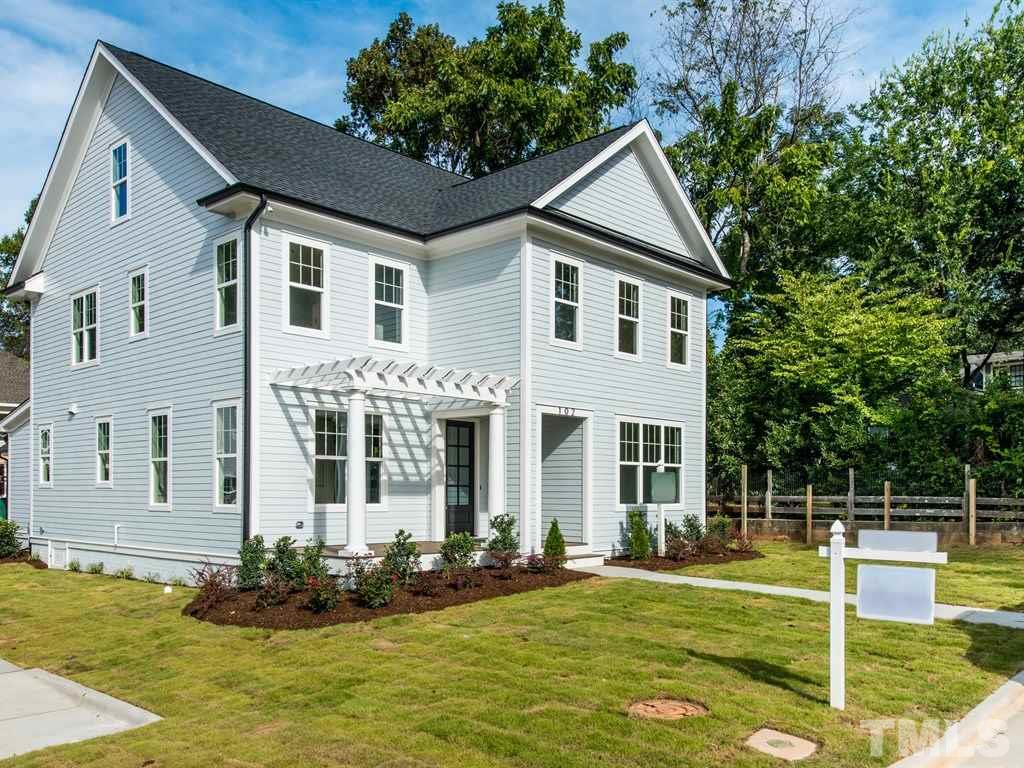 102 Revival Way Raleigh, NC 27608 - Photo 1 of 25 a front view of a house with a yard