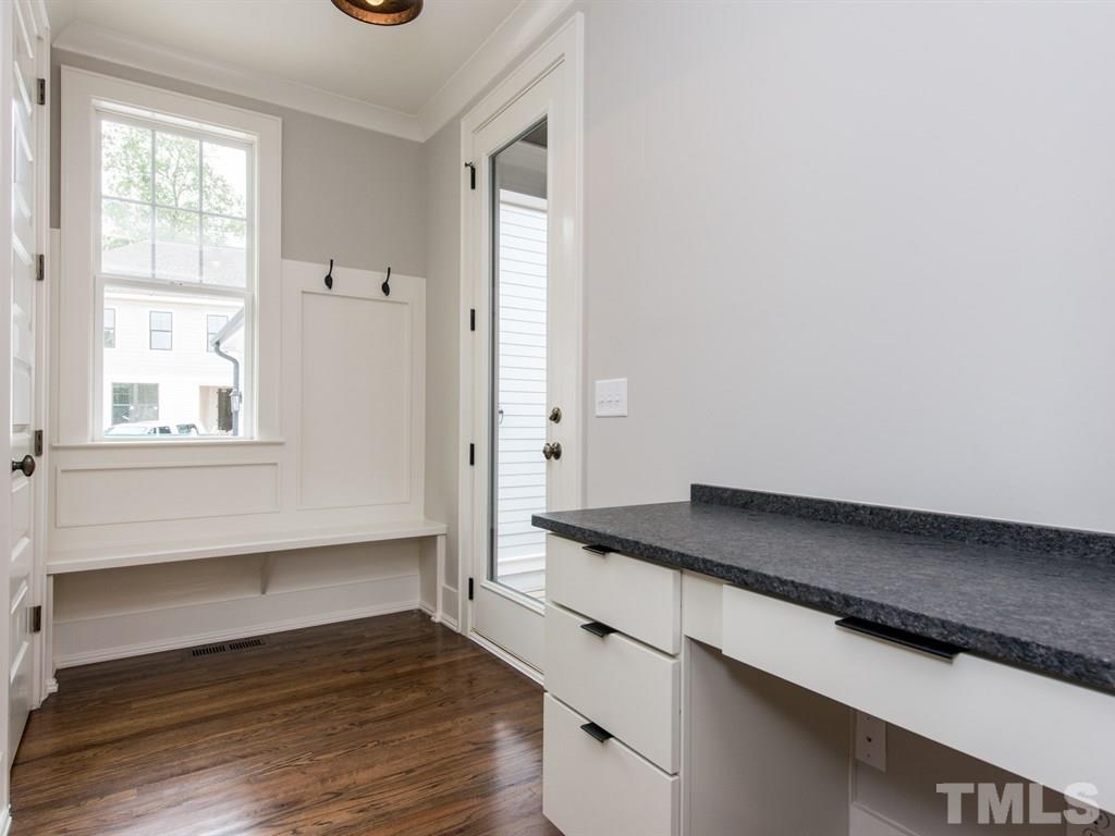 102 Revival Way Raleigh, NC 27608 - Photo 11 of 25 a kitchen with granite countertop a sink and a stove