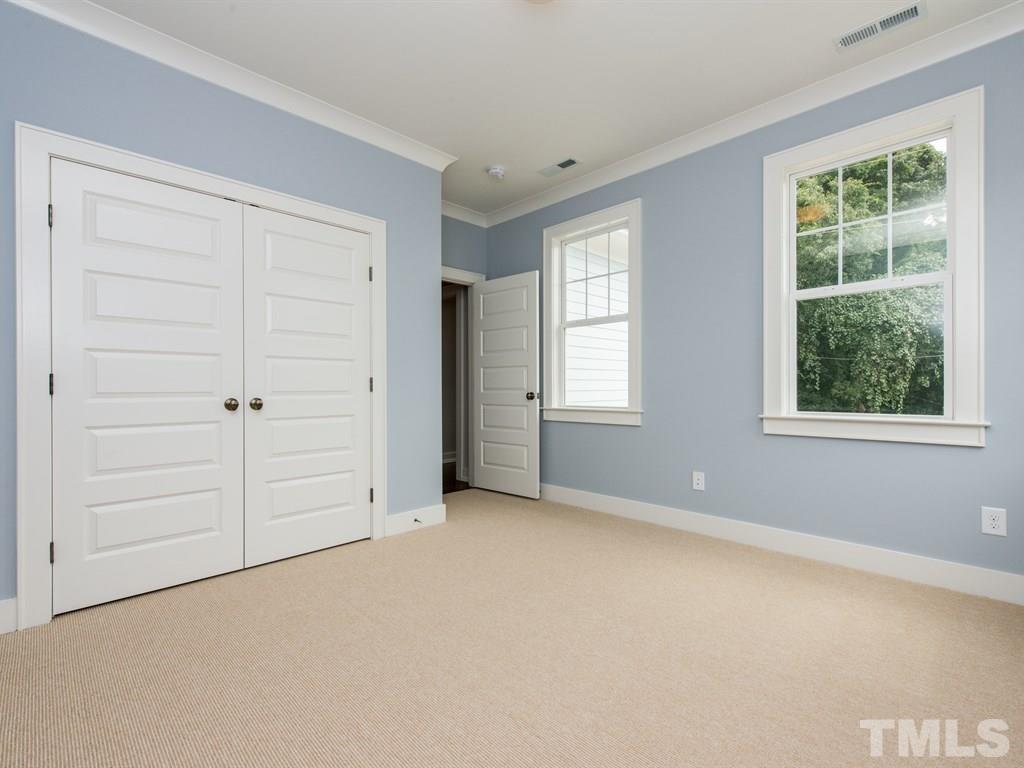 102 Revival Way Raleigh, NC 27608 - Photo 19 of 25 an empty room with windows