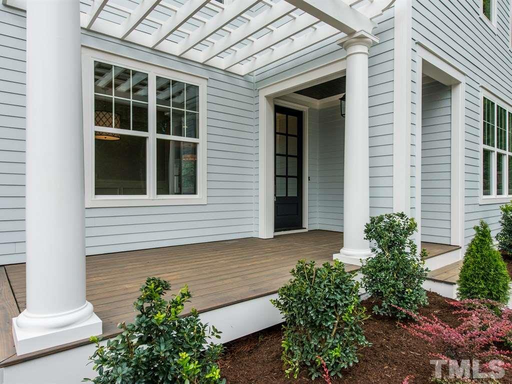 102 Revival Way Raleigh, NC 27608 - Photo 3 of 25 a view of a house with potted plants