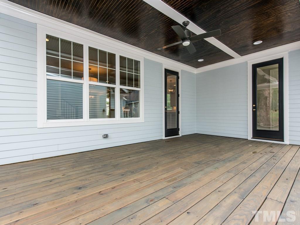 102 Revival Way Raleigh, NC 27608 - Photo 22 of 25 a view of an empty room with wooden floor