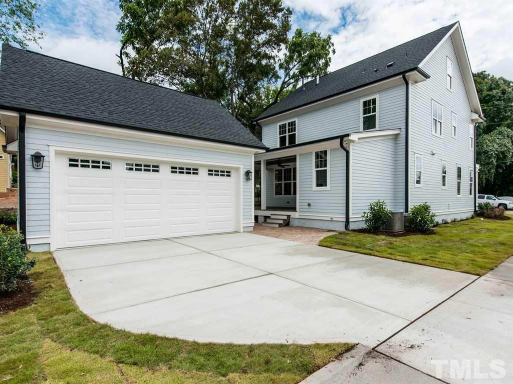 102 Revival Way Raleigh, NC 27608 - Photo 23 of 25 a view of a white house with a yard