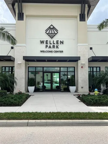 a view of a brick house with a large windows