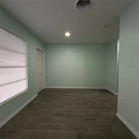 a view of an empty room and window