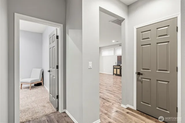 a bedroom with a bed and a chair