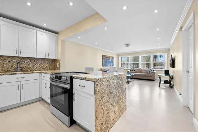 a kitchen with sink and cabinets
