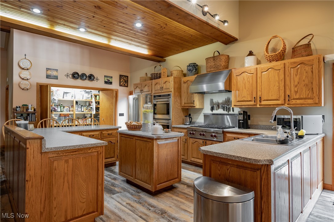8089 Elk Fork Road Middlebourne, WV 26149 - Photo 6 of 50 Gormet Kitchen, With Custom Hand Made Solid Oak Cabinets, Premium Stainless Stell Appliances, Premium LVT Flooring, Breakfast Bar, Large Pantry, French Doors to Deck, Custom Lighting