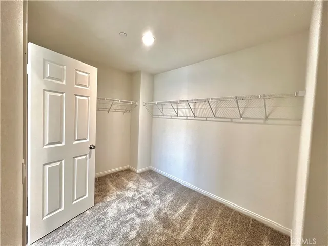 a view of storage and utility room with a washer dryer