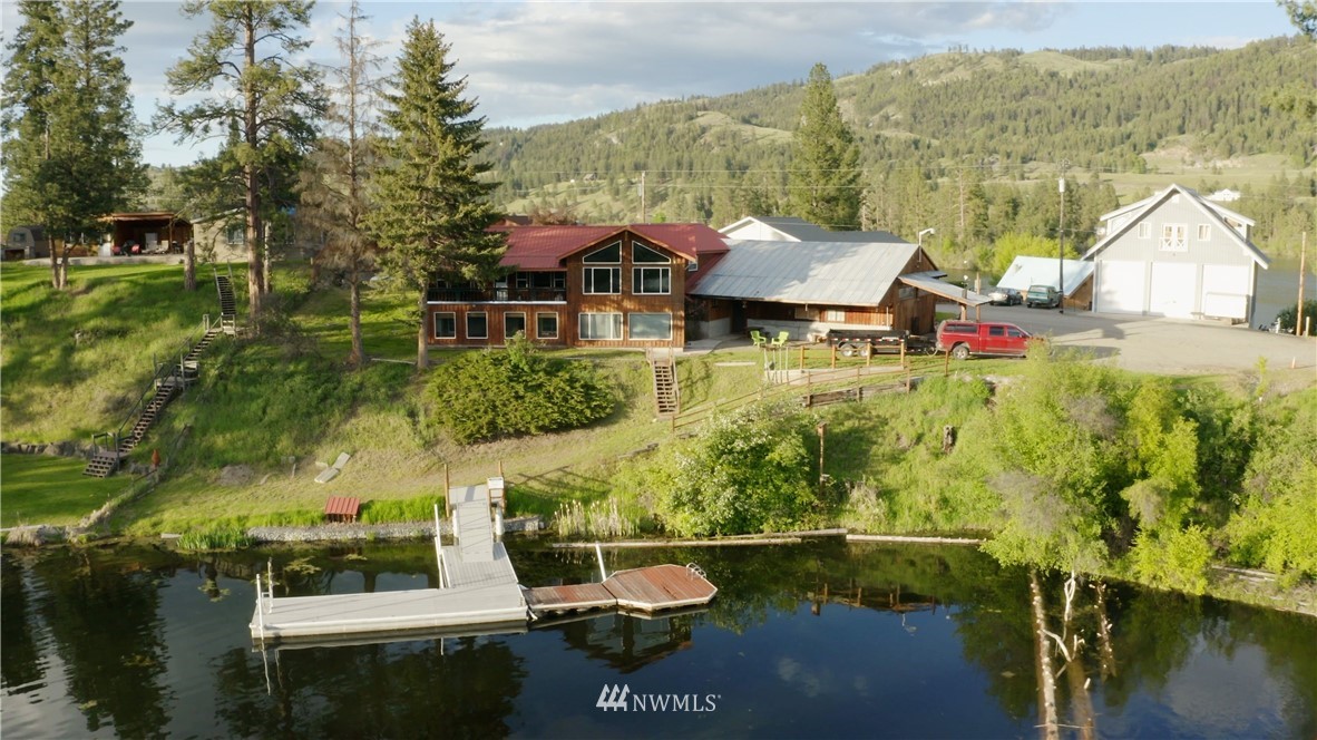a view of a lake with a house in the background