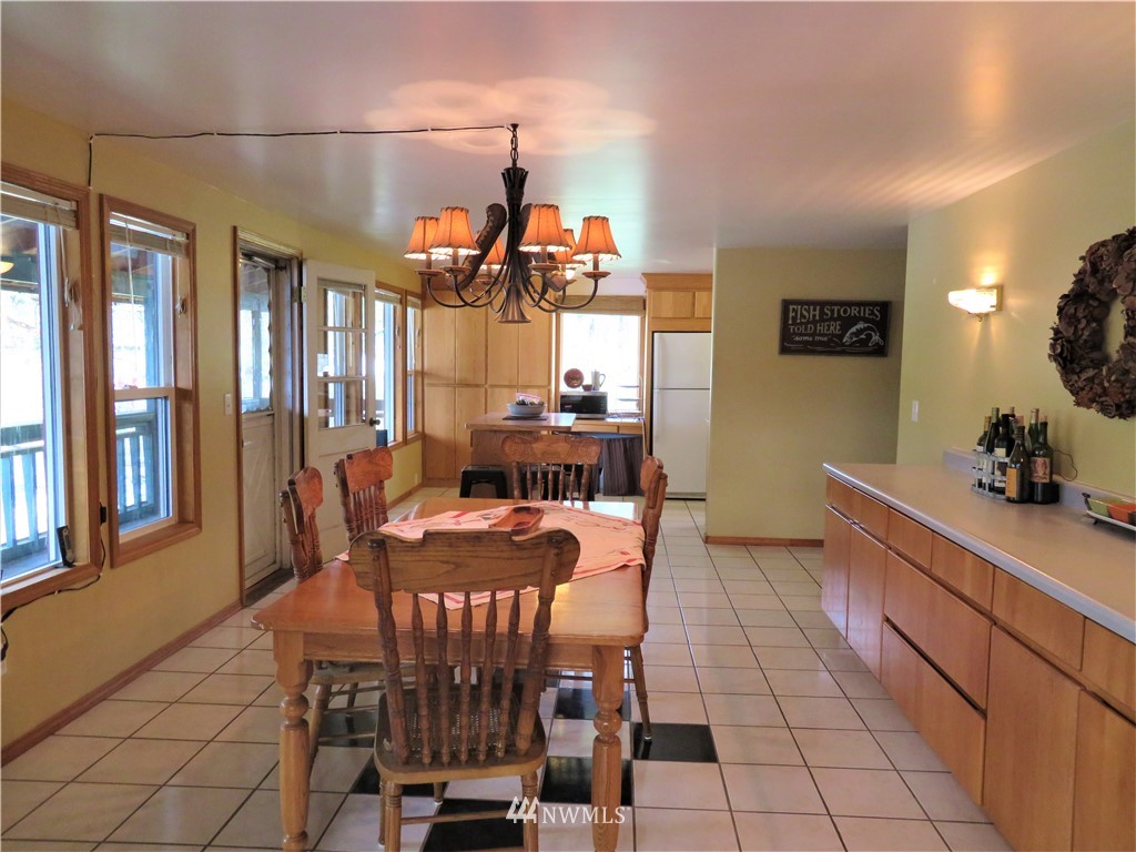 58 Petes Retreat Road Republic, WA 99166 - Photo 11 of 32 a dining room with furniture and window