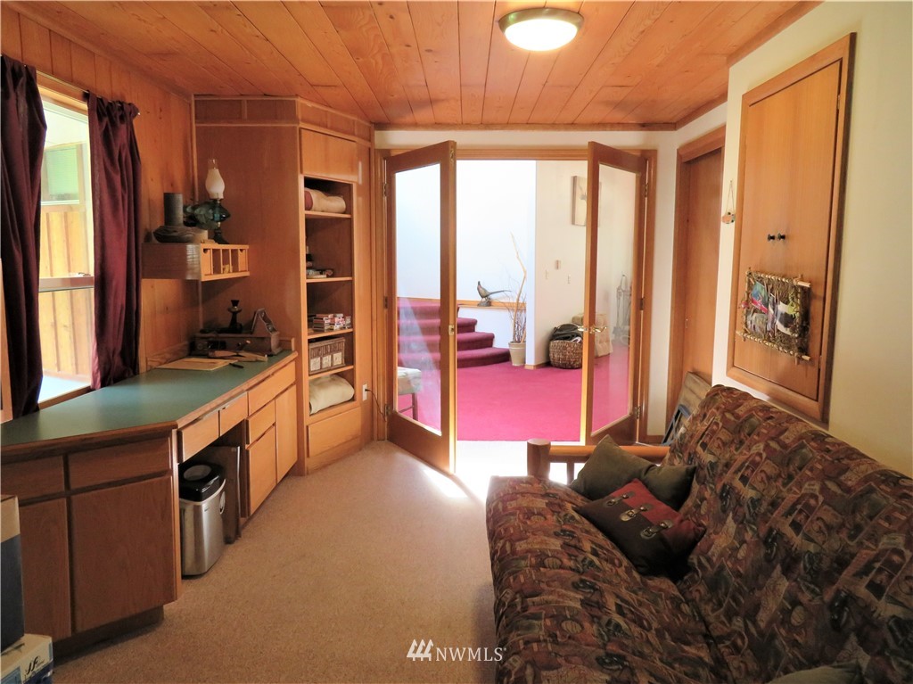 58 Petes Retreat Road Republic, WA 99166 - Photo 15 of 32 a bedroom with furniture and large windows