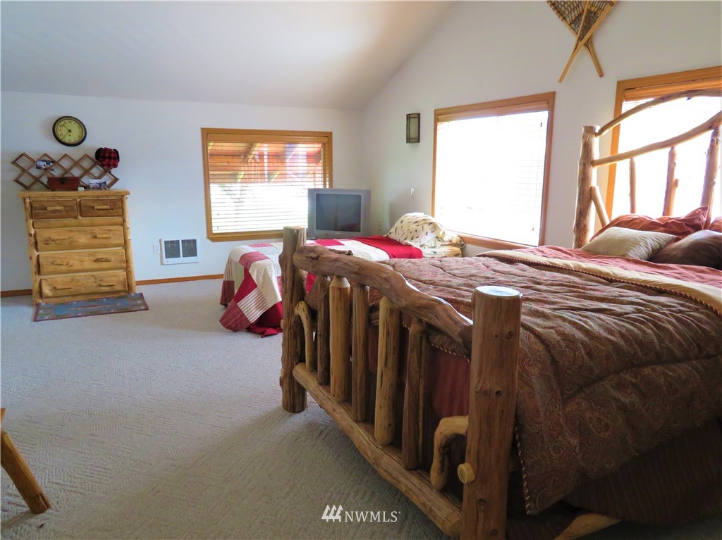 58 Petes Retreat Road Republic, WA 99166 - Photo 17 of 32 a bedroom with a bed and a window