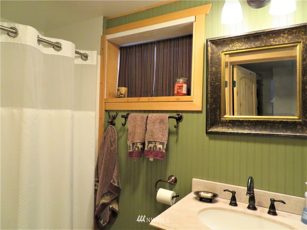 58 Petes Retreat Road Republic, WA 99166 - Photo 22 of 32 a bathroom with a sink and a mirror