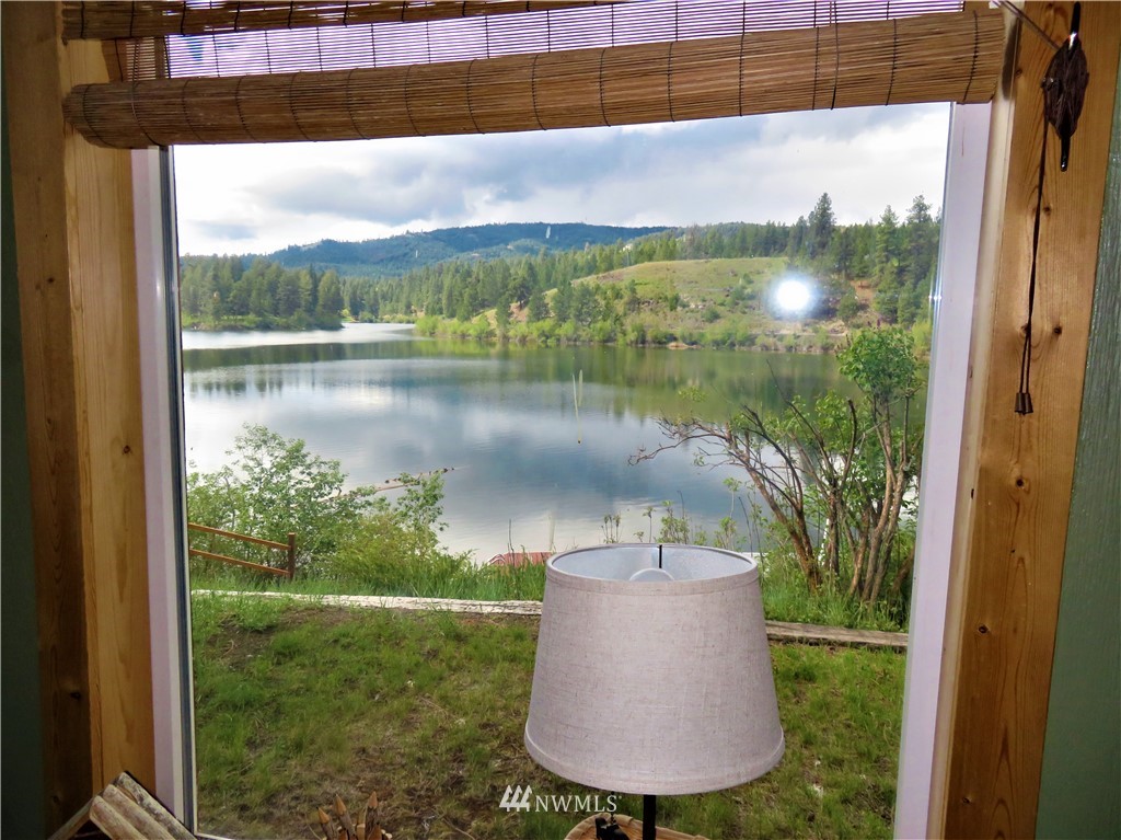 58 Petes Retreat Road Republic, WA 99166 - Photo 25 of 32 a view of a lake from a yard