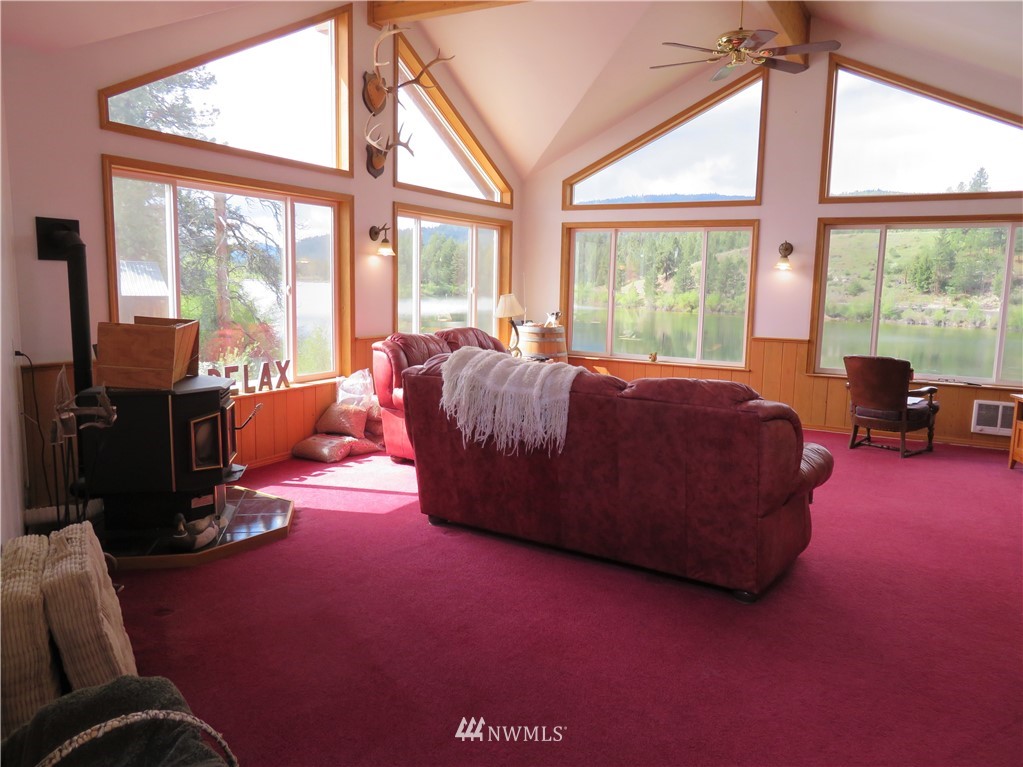 58 Petes Retreat Road Republic, WA 99166 - Photo 6 of 32 a living room with furniture and large windows