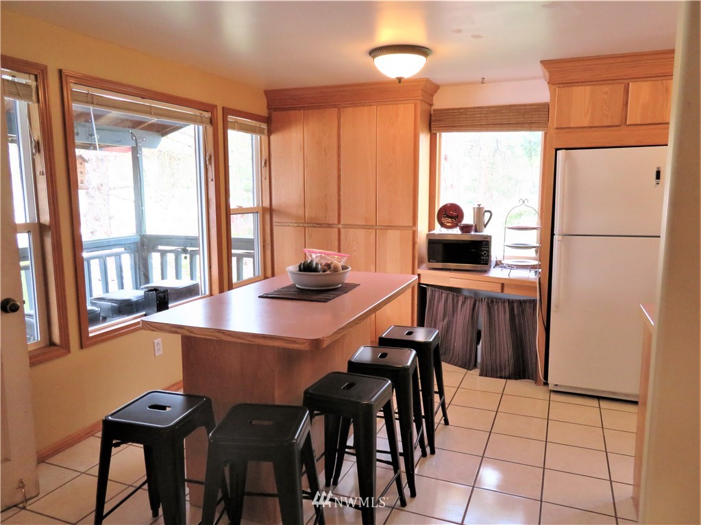 58 Petes Retreat Road Republic, WA 99166 - Photo 9 of 32 a view of a dining room with furniture window and outside view