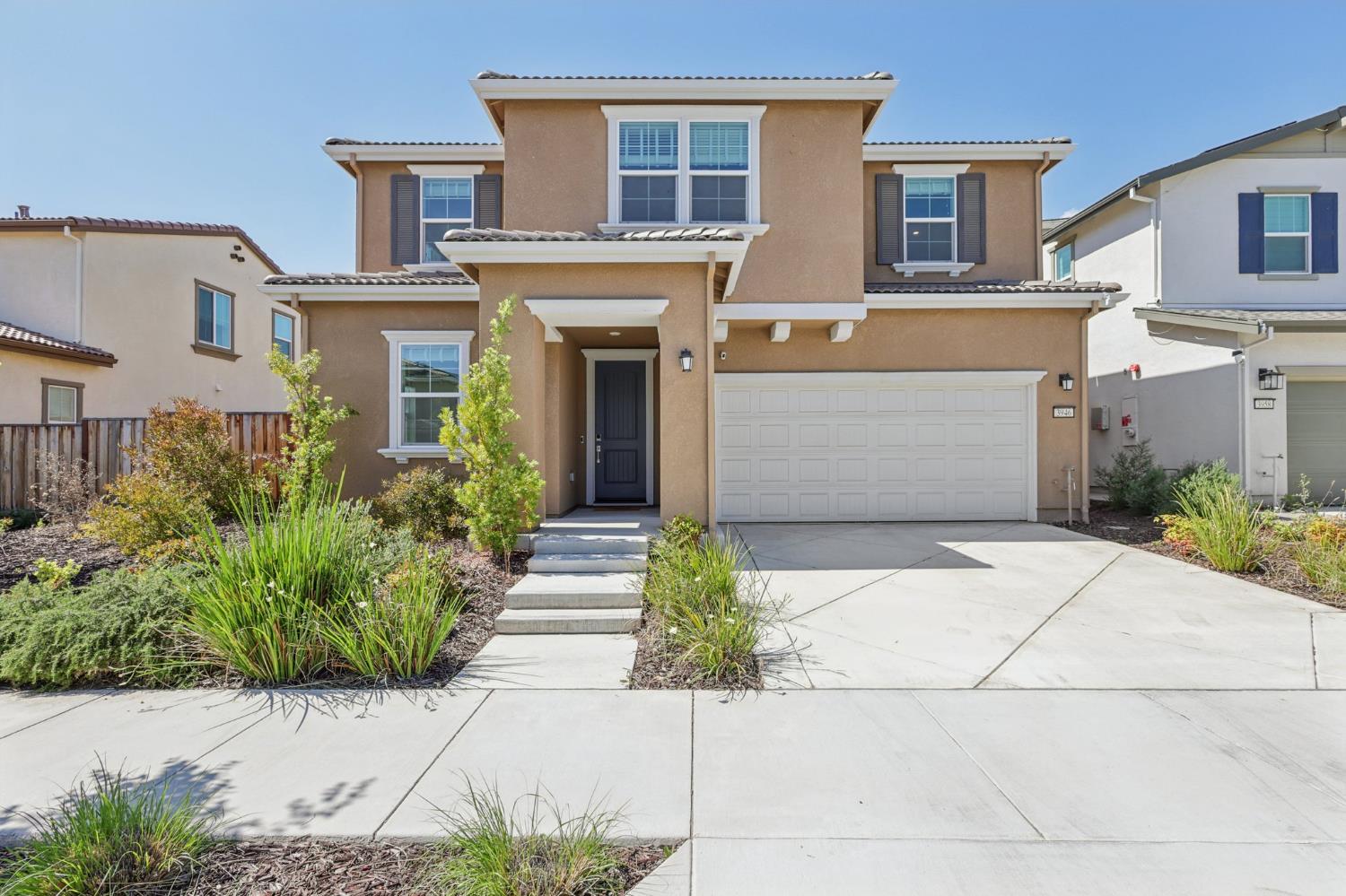 3946 Needham Street Tracy, CA 95377 - Photo 1 of 40 a front view of a house with a garden
