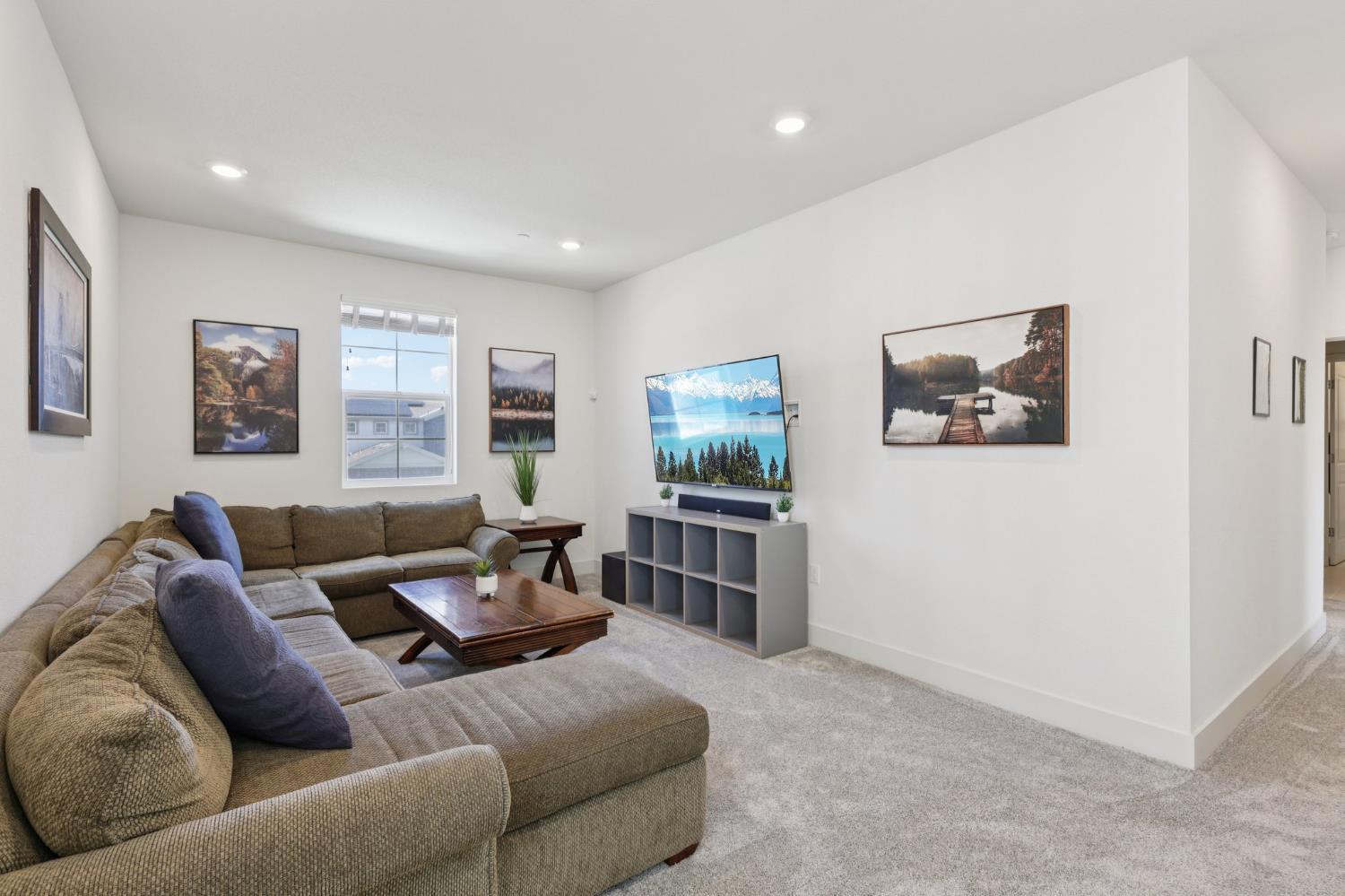 3946 Needham Street Tracy, CA 95377 - Photo 16 of 40 a living room with furniture and a flat screen tv