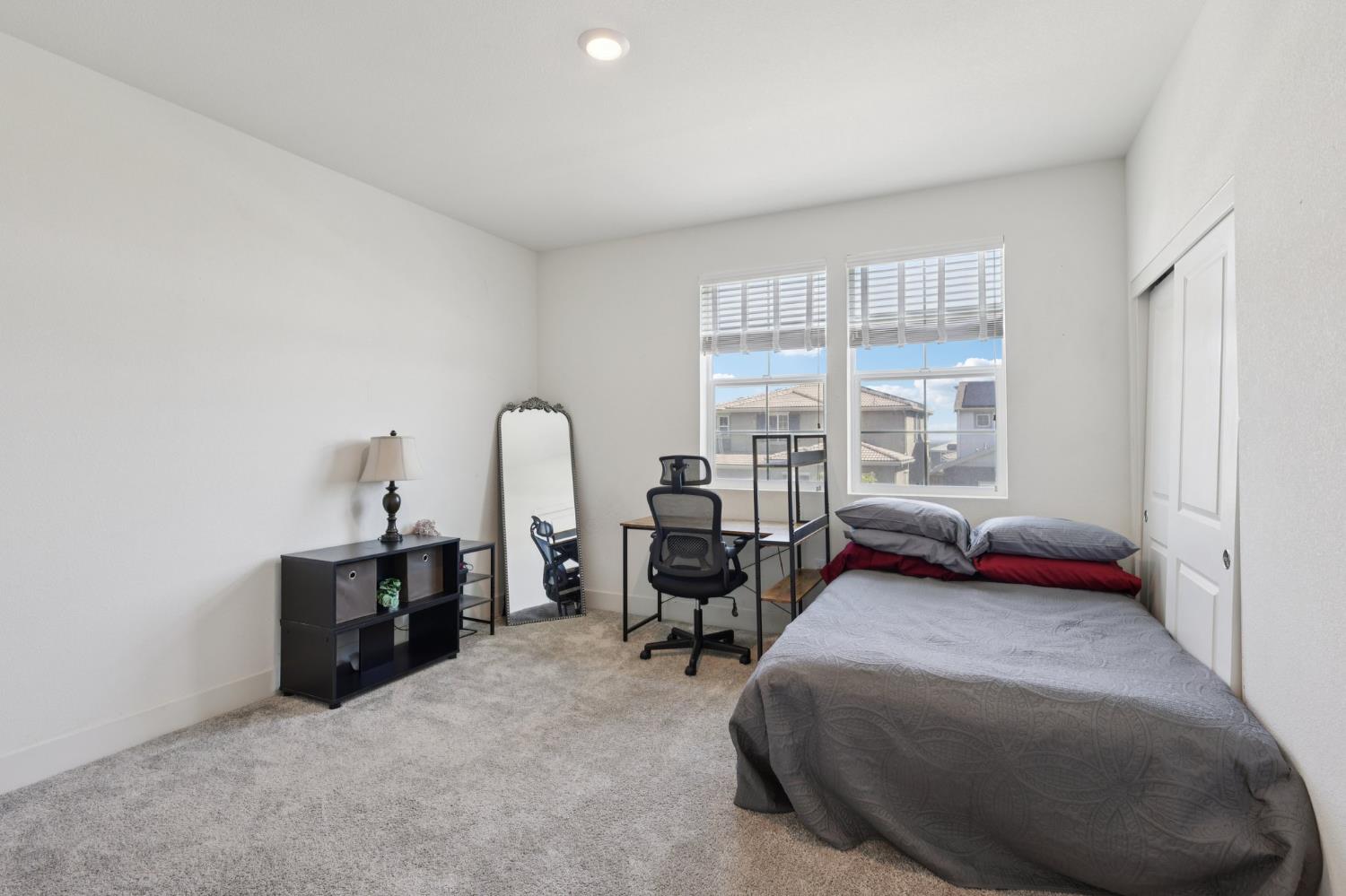 3946 Needham Street Tracy, CA 95377 - Photo 19 of 40 a bed room with furniture and a window