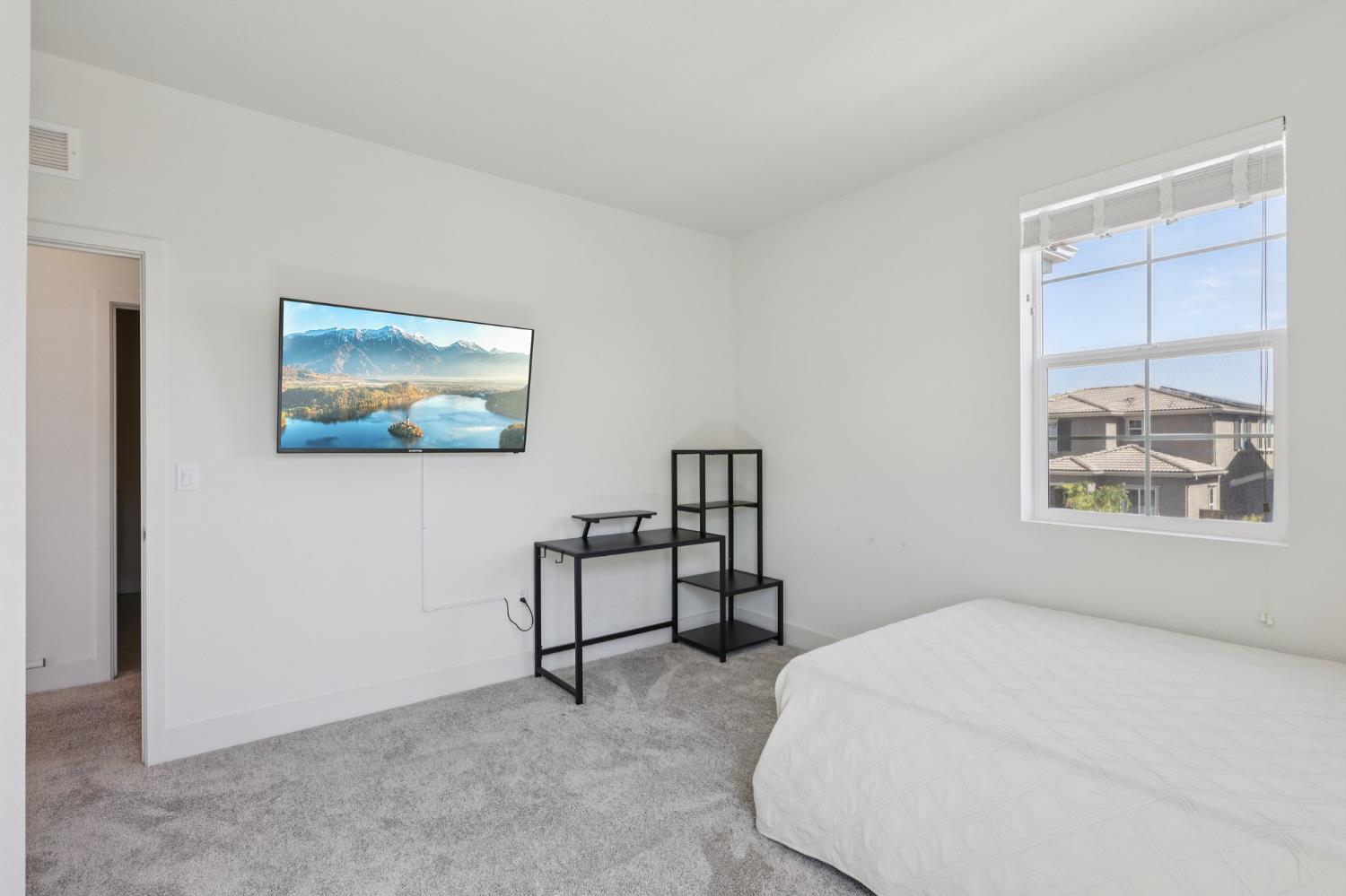 3946 Needham Street Tracy, CA 95377 - Photo 22 of 40 a bedroom with a bed and a window