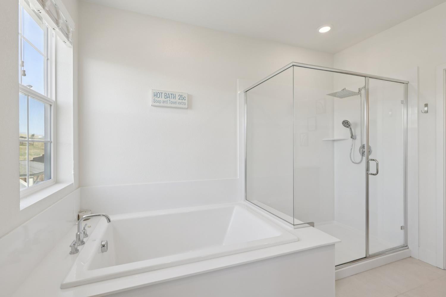 3946 Needham Street Tracy, CA 95377 - Photo 27 of 40 a bathroom with a shower and a bath tub