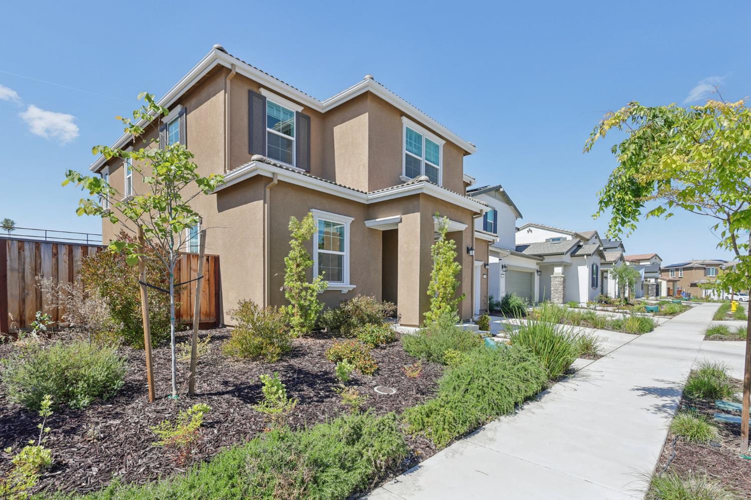 3946 Needham Street Tracy, CA 95377 - Photo 3 of 40 a front view of a house with garden
