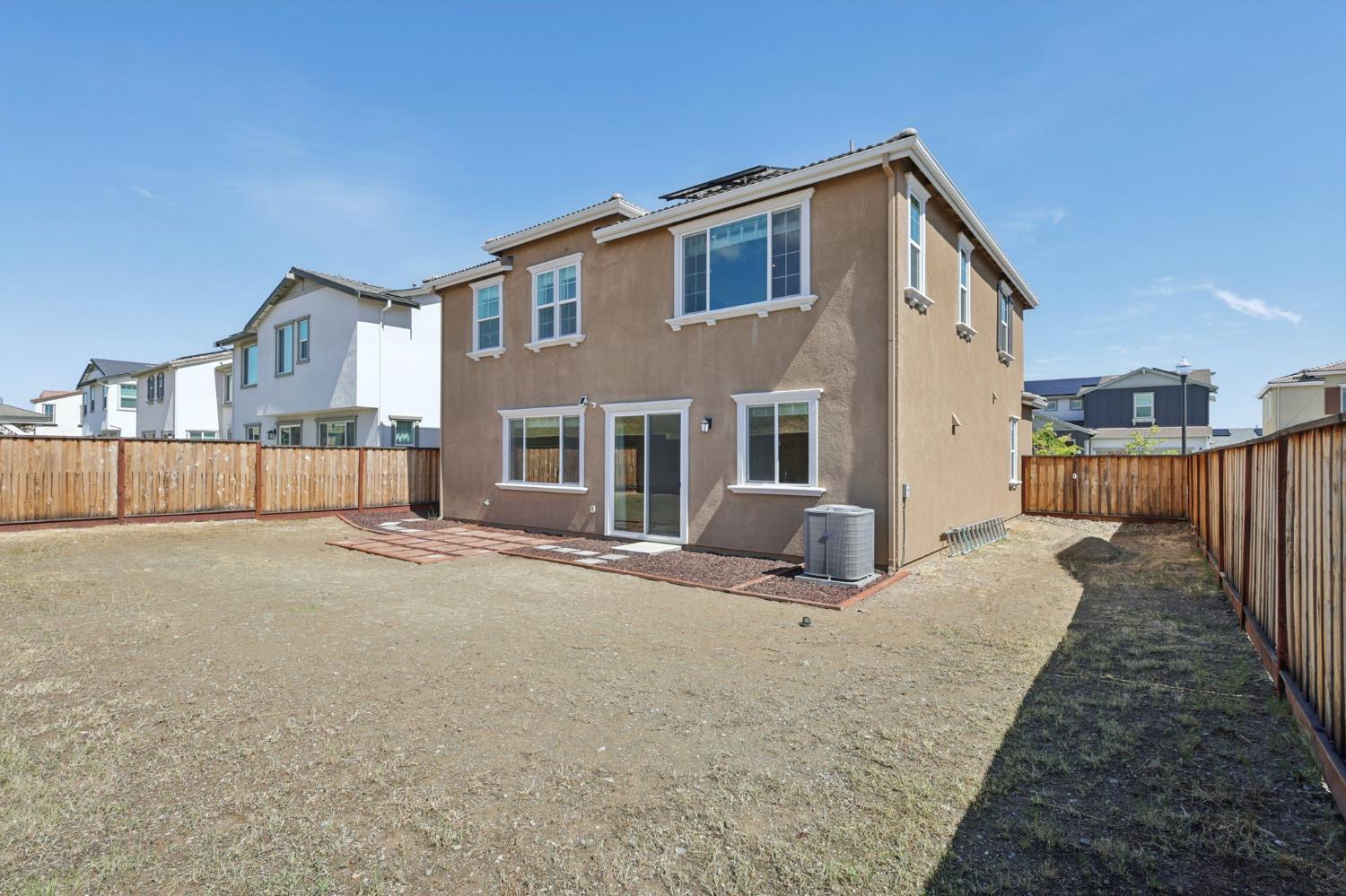 3946 Needham Street Tracy, CA 95377 - Photo 31 of 40 a view of a house with a patio