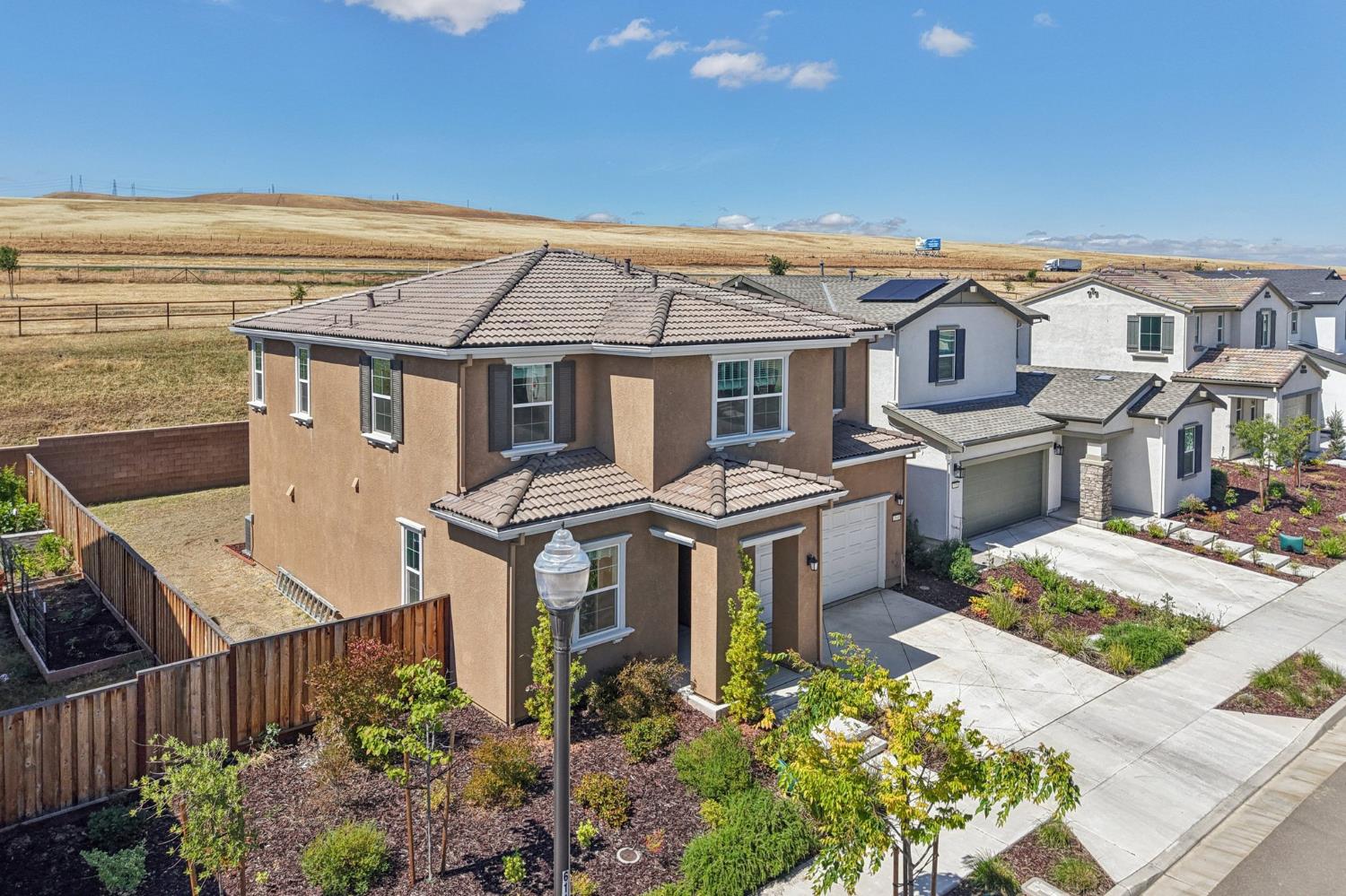 3946 Needham Street Tracy, CA 95377 - Photo 33 of 40 a front view of a house with a garden