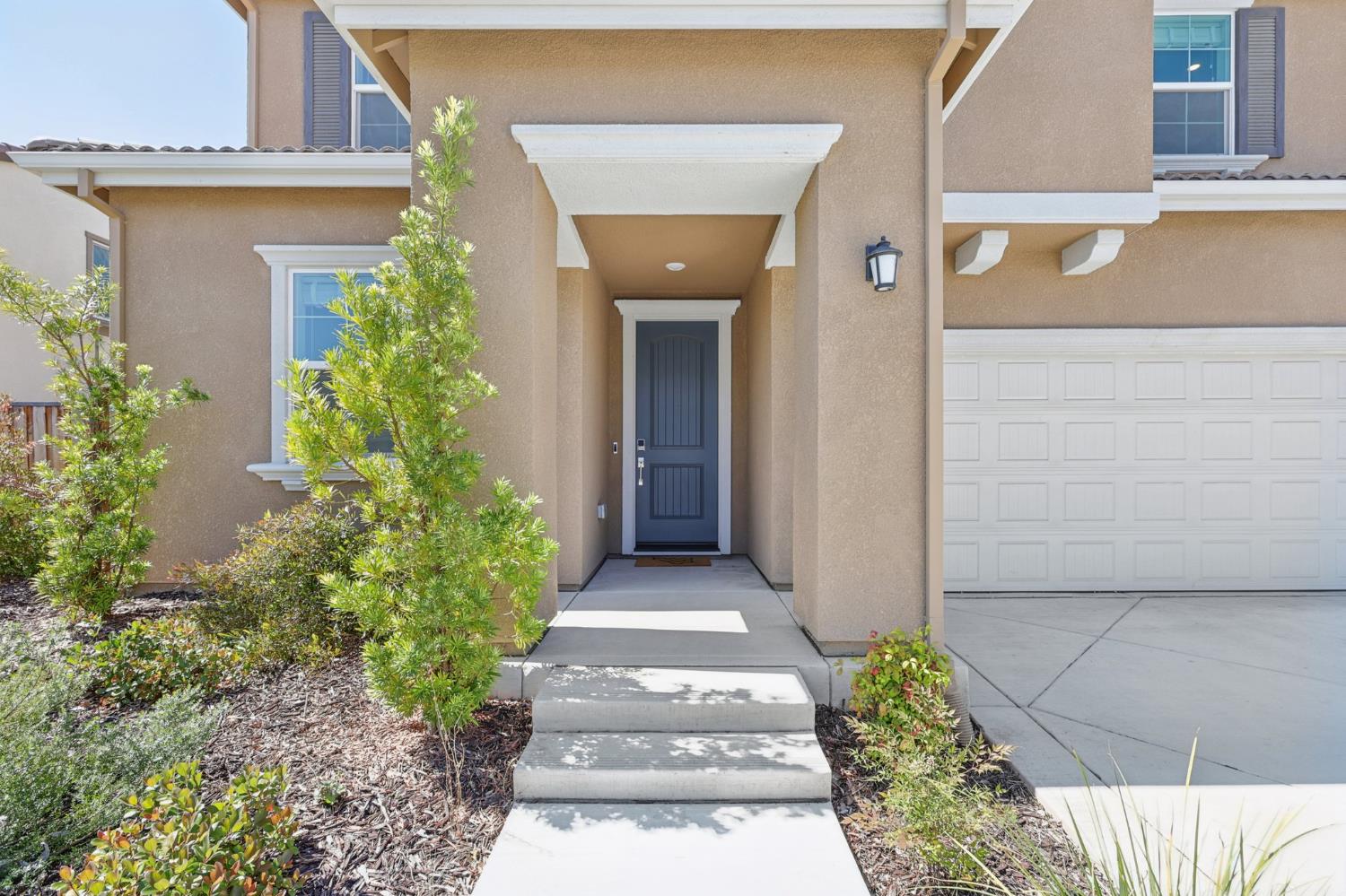 3946 Needham Street Tracy, CA 95377 - Photo 4 of 40 front view of a house with a porch