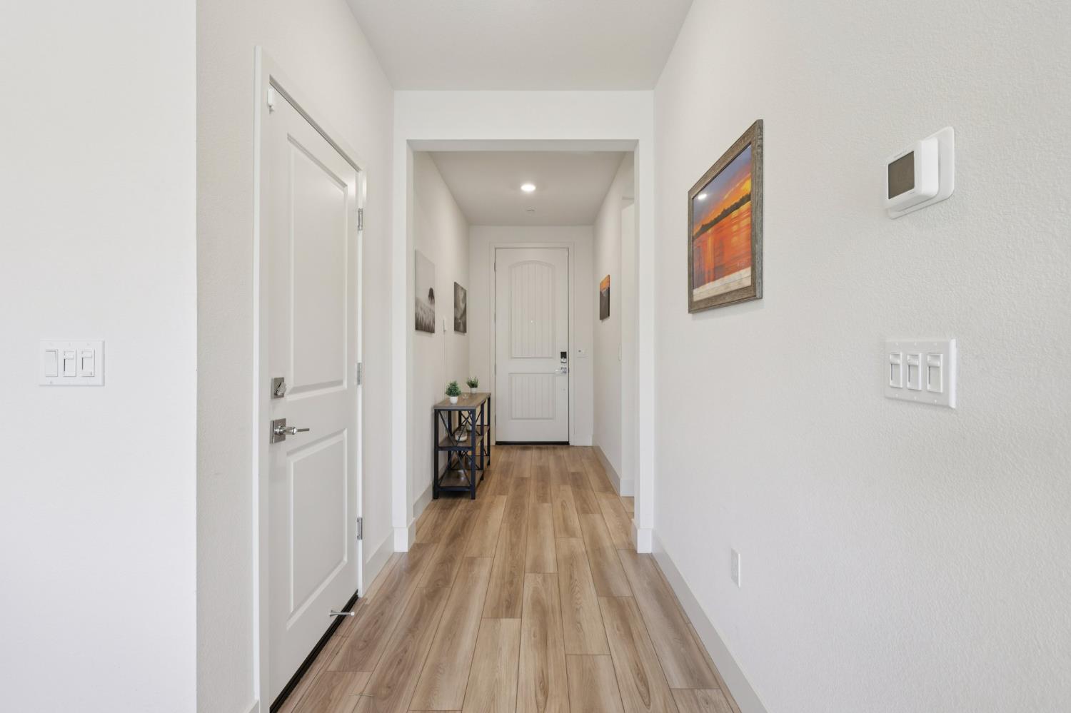 3946 Needham Street Tracy, CA 95377 - Photo 5 of 40 a view of a hallway with wooden floor and closet